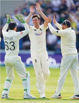  ?? — AP ?? England’s Craig Overton (centre) celebrates the dismissal of India’s Mohammed Shami during the first day of third Test at Headingley on Wednesday.