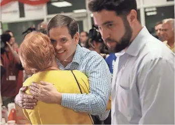  ?? JOE RAEDLE, GETTY IMAGES ?? Sen. Marco Rubio thanks a volunteer at a phone bank Monday as he gears up for the primary.