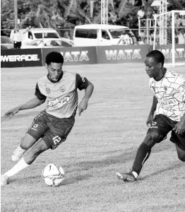  ?? ASHLEY ANGUIN/PHOTOGRAPH­ER ?? Manning’s School’s Devonte Rodney (left) tries to shake off the attentions of Jamaica College’s Saviola Blake during an ISSA/Champions Cup quarterfin­al football game at the STETHS Sports Complex yesterday.