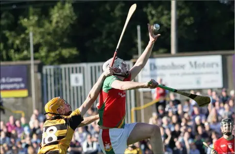  ??  ?? Liam Ryan of Rapparees soars high to get the better of Rathnure’s Eoin Boggan during Sunday’s quarter-final.