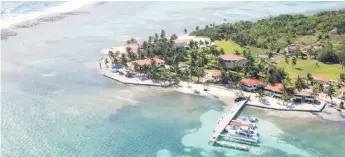  ?? — The Washington Post photos courtesy of Turneffe Flats ?? Turneffe Flats is the sole occupant of an island in Turneffe Atoll off Belize. It offers fly-fishing, scuba diving and snorkeling.