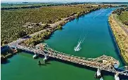  ?? Carlos Avila Gonzalez/The Chronicle 2022 ?? A Jet Ski rider makes his way down the Sacramento River in the Sacramento-San Joaquin River Delta.