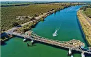  ?? Carlos Avila Gonzalez/The Chronicle 2022 ?? A Jet Ski rider makes his way down the Sacramento River in the Sacramento-San Joaquin River Delta.