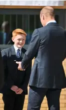  ?? SAMIR HUSSEIN/WIREIMAGE ?? Prince William is greeted by Freddie Hadley (above) and other pupils and staff at St Michael’s Church of England School in Rowley Regis yesterday