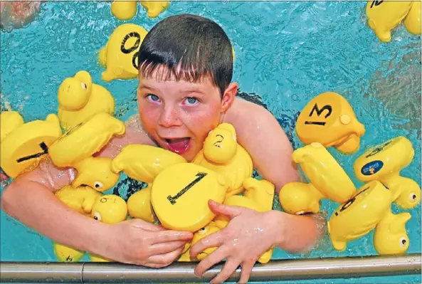  ??  ?? Quacking good fun: Plimmerton School pupil Joshua Baxter, 10, is set for a much-anticipate­d plastic duck race at this Saturday’s school gala. Money raised will go towards the school’s swimming programme and a playground revamp.