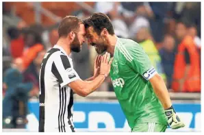  ?? — Reuters ?? Full of passion: Juventus’ Gonzalo Higuain (left) and goalkeeper Gianluigi Buffon celebratin­g after the match against Inter Milan at the San Siro last Wednesday.