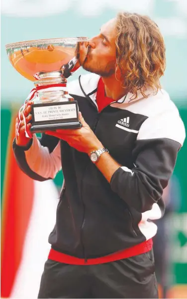  ?? Agence France-presse ?? Stefanos Tsitsipas kissses the trophy after winning the final match of the Monte Carlo ATP Masters Series in Monaco on Sunday.