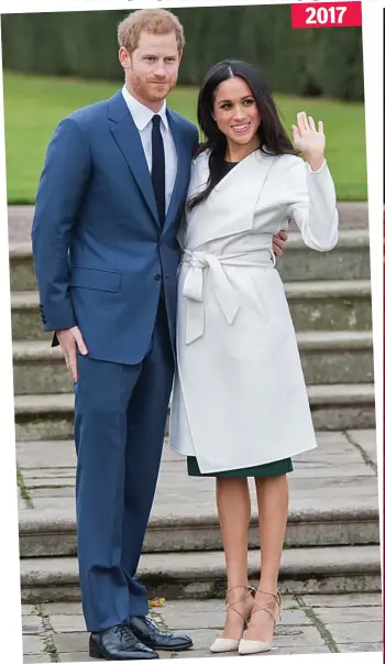  ??  ?? Wrap coat: The couple announce their engagement at Kensington Palace