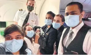  ?? AISHA KHATIB VIA THE CANADIAN PRESS ?? Dr. Aisha Khatib, left, poses with crew members, pediatrici­an Carola Buscemi, second from left, and the baby they helped deliver.