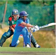  ?? — PTI ?? Harmanpree­t Kaur in action against Bangladesh at the Asia Cup 2018 in Kuala Lumpur.
