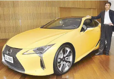  ??  ?? Lexus Manila, Inc. (LMI) president Raymond Rodriguez next to the LX 570 with the Sunflare Brown interior option LMI EVP Yuichiro Suzuki with the LC 500, a world-class prestige luxury coupe which boasts of an all-new platform, 471 horsepower and a...