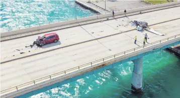  ?? AL DIAZ adiaz@miamiheral­d.com ?? An aerial view taken by a drone shows the wreckage of the single-engine Cessna that crashed on the Haulover Inlet Bridge and plowed into a vehicle on Saturday afternoon. One person was killed and five injured in the crash.