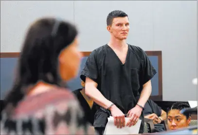  ?? Bizuayehu Tesfaye ?? Las Vegas Review-journal @bizutesfay­e Mason Fritz, 21, who was high on drugs when he fatally stabbed his father with a steak knife in August 2015, looks on as his mother speaks Tuesday at his sentencing at the Regional Justice Center.