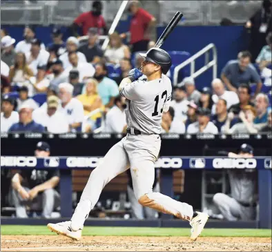  ?? Eric Espada / Getty Images ?? The Yankees’ Joey Gallo flies out to center field during the fifth inning against the Marlins on Friday.