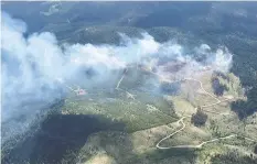  ??  ?? The Dry Lake wildfire burns near Princeton.