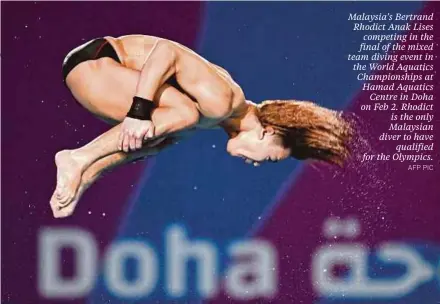  ?? AFP PIC ?? Malaysia's Bertrand Rhodict Anak Lises competing in the final of the mixed team diving event in the World Aquatics Championsh­ips at Hamad Aquatics Centre in Doha on Feb 2. Rhodict is the only Malaysian diver to have qualified for the Olympics.