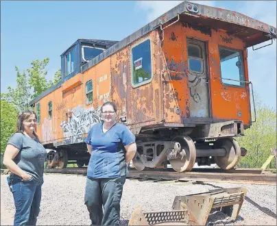  ?? ERIC MCCARTHY/JOURNAL PIONEER ?? Judy Morrissey-Richard, right, owner of MJ’s Bakery, and her sister Darlene Morrissey, are proud to have a symbol of CN Rail’s years in Tignish returned to the community. The caboose, situated in her business lot just across the street from where the...