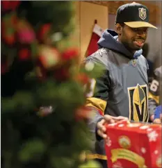  ?? Daniel Clark ?? Las Vegas Review-journal Golden Knights goaltender Malcolm Subban organizes presents Thursday at the Children’s Hospital of Nevada at University Medical Center.