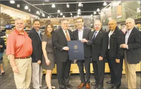  ?? Contribute­d photo ?? ShopRite of Cromwell held a grand opening at 45 Shunpike Road on May 18. From left are Middlesex County Chamber of Commerce Chairman Don DeVivo, Mayor Enzo Faienza, state Rep. Christie Carpino, owner Harry Garafalo, state Sen. Matt Lesser, past chamber chairman Jay Polke, Town Manager Tony Salvatore and Chamber President Larry McHugh.