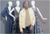  ?? DAMIAN DOVARGANES/AP ?? Kevan Hall with his “Galaxy Collection” at his haute couture atelier March 19 in West LA. He’s been getting calls from clients about dressed-up looks.