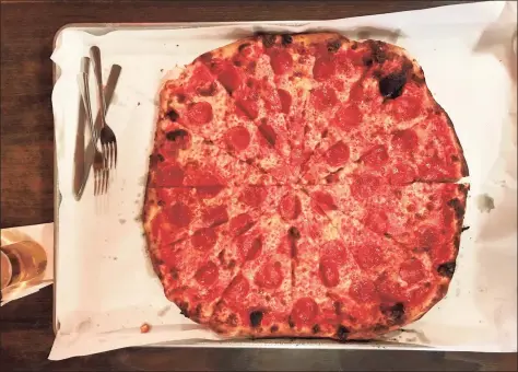  ?? Greg Morago / Contribute­d photo ?? A tomato, mozzarella, and pepperoni pizza from Sally’s Apizza on New Haven’s Wooster Street.