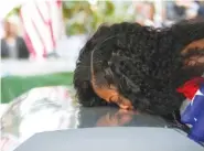  ?? MATIAS J. OCNER/MIAMI HERALD VIA AP ?? Myeshia Johnson kisses the casket of her husband,
Sgt. La David Johnson, during his burial service at Fred Hunter’s Hollywood Memorial Gardens in Hollywood, Fla., on Saturday.