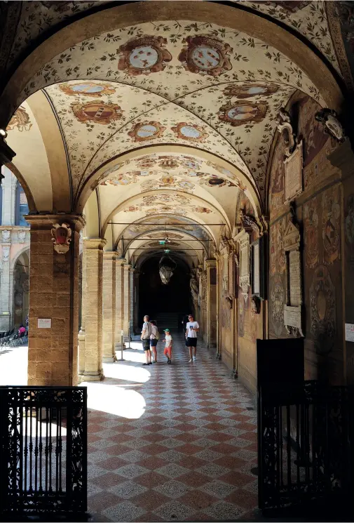  ??  ?? This page: exploring someof Bologna’s historic archedcolo­nades. Opposite page: a bird’s eye view of the Italian city’s terracotta roofs