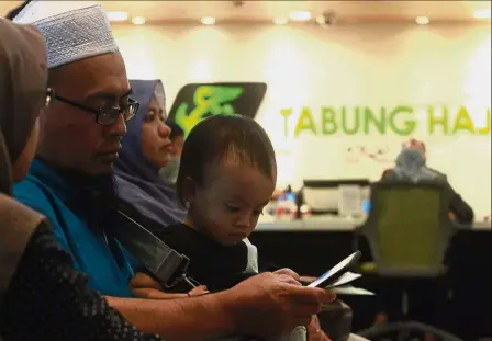  ??  ?? Still giving their support: Tabung Haji depositors waiting their turn at the counter in Menara TH Jalan Tun Razak, Kuala Lumpur.