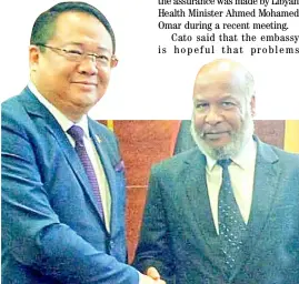  ?? DFA PHOTO ?? Fruitful dialogue Philippine Charge’ d’Affaires Elmer Cato shakes hand with Libyan Health Minister Ahmed Mohamed Omar after tackling issues concerning Filipino medical workers in Tripoli.
