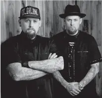  ?? PHOTO BY CHRIS PIZZELLO/INVISION VIA AP ?? Benji Madden, left, and his twin brother Joel Madden of the band Good Charlotte pose for a portrait, in Burbank, Calif., on Tuesday. The city of Annapolis, Md., will hold a benefit concert July 28 featuring the Maryland-based band to honor the five...