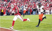  ?? [PHOTO BY NATE BILLINGS, THE OKLAHOMAN] ?? Oklahoma’s Marquise Brown scores a touchdown in the 2018 Bedlam game. Wednesday, Brown declared for the NFL Draft.