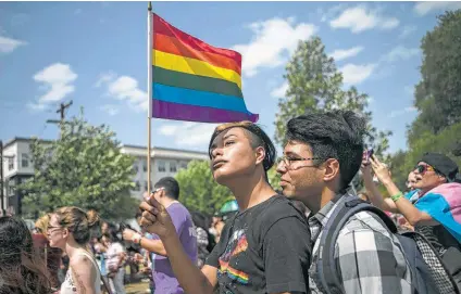  ?? Josie Norris / San Antonio Express-News ?? Damien Placios and his partner, Paul Hidalgo, are at Crockett Park on Saturday for the annual Pride Festival.