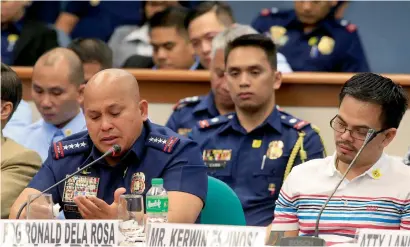  ?? Reuters ?? Philippine National Police chief Ronald Dela Rosa cries while Kerwin Espinosa attends a hearing at the Senate headquarte­rs in Pasay city, metro Manila, Philippine­s, on Wednesday. —