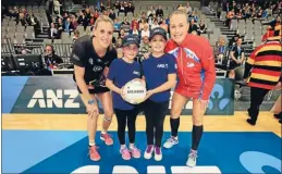  ??  ?? Waikato BOP Magic Captain Leana de Bruin, with ANZ Future Captains, Ainsley Harrison, 9 and Ellie Arlidge-Burton,10 and NSW Swifts captain Kimberlee Green at the ANZ Championsh­ip semi-final between the Magic and Swifts.