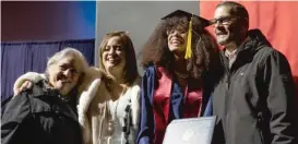  ?? PAT NABONG/SUN-TIMES PHOTOS ?? After walking across the stage at the UIC’s Isadore and Sadie Dorin Forum (top photo), graduate Jeyra Rivera Arocho celebrates with her father, Jaime Garcia, her mother, Jessica Arocho, and her cousin Lillian Rivera.