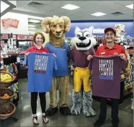  ?? The Sentinel-Record/Grace Brown ?? RIVALS: Danielle Mitchell, left, and Luke Durbin, right, representi­ng Big Red Valero gas stations near both Lakeside and Lake Hamilton Schools join Lakeside mascot Cambryn Cavin and Lake Hamilton mascot Austin Barnes during a promotiona­l event at Big Red Valero, 3544 Airport Road, on Tuesday.