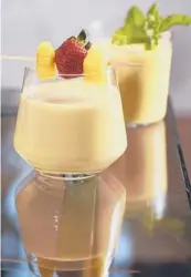  ??  ?? Let a tropical fruit smoothie transport you to a tiki bar.