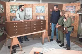  ?? HGTV PHOTOS ?? "Property Brothers" hosts Drew Scott, left, and his brother, Jonathan, show off a set of drawers that will be be part of “A Very Brady Renovation” to “The Brady Bunch” stars Maureen McCormick and Susan Olsen.