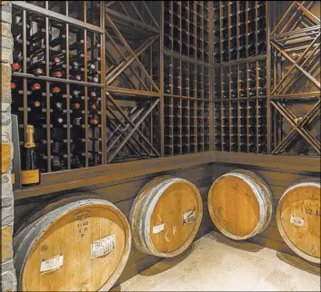  ?? COURTESY ?? The Summerlin golf-course home has a wine cellar.