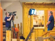  ?? SUN-NEWS PHOTOS ?? Scott Hummelshei­m, left, a producer and video journalist with C-SPAN, prepares to interview Craig Massey, right, the communicat­ions manager for the New Mexico Farm and Ranch Heritage Museum on Tuesday.