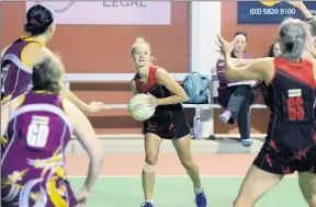  ??  ?? Kyabram’s Lauren Clymo applies some defensive pressure as her teammate Holly Butler (right) looks to slice through a gap in the Goulburn Valley League A grade netball match against Shepparton on Saturday night. Pictures: Rodney Braithwait­e.