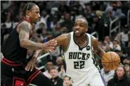  ?? MORRY GASH — THE ASSOCIATED PRESS ?? Milwaukee Bucks’ Khris Middleton drives past Chicago Bulls’ Demar Derozan during Game 1of their first round game Sunday, in Milwaukee.