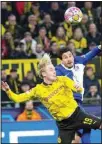  ?? ?? Dortmund’s Julian Brandt, (left), and Atletico Madrid’s Jose Gimenez challenge for the ball during the Champions League quarterfin­al second leg soccer match between Borussia Dortmund and Atletico Madrid at the Signal-Iduna Park in Dortmund, Germany. (AP)