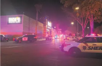  ?? Lauren Hernandez / The Chronicle ?? More than a dozen law enforcemen­t vehicles park outside the Great Mall in Milpitas after reports of a shooting there. It wasn’t immediatel­y clear whether anyone was injured.