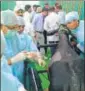  ?? HT PHOTO ?? The PM watched the surgery of a bull which had plastic in its stomach.