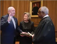 ?? PHOTO BY USDA ?? Sonny Perdue, with his wife Mary, takes the oath of office Tuesday administer­ed by Associate Justice Clarence Thomas in the U.S. Supreme Court Building, becoming the 31st U.S. Secretary of Agricultur­e.