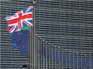  ??  ?? The Union flag flies outside the EU headquarte­rs in Brussels