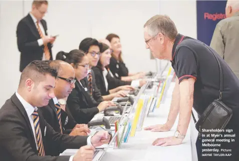  ?? Picture: WAYNE TAYLOR/AAP ?? Shareholde­rs sign in at Myer's annual general meeting in Melbourne yesterday.