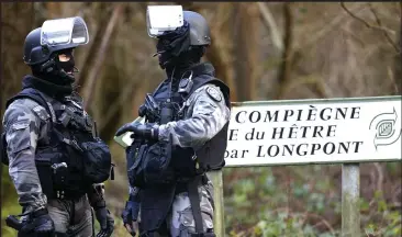  ??  ?? Manhunt: Police officers near the town of Villers-Cotterets yesterday