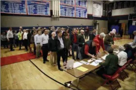  ?? MATT ROURKE — THE ASSOCIATED PRESS ?? Voters line up to vote at a polling place Tuesday in Doylestown, Pa.